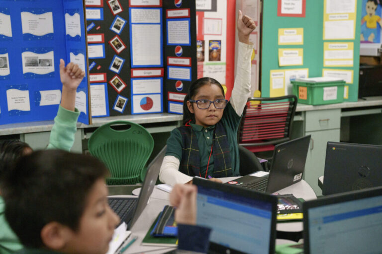 Raised hands at Clinton Elementary 1024x683